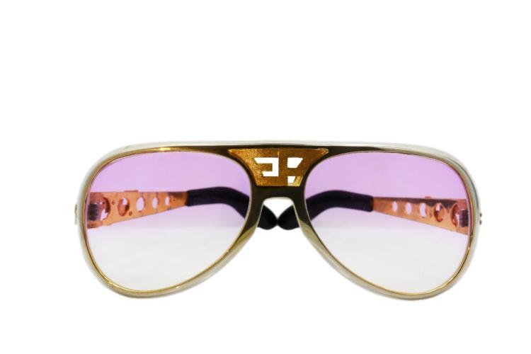 Elvis Presley's Personally Owned "Last Hawaiian Vacation" 14K, Chrome & Plastic Custom Sunglasses, sold for $130,000. Image: GWS Auctions