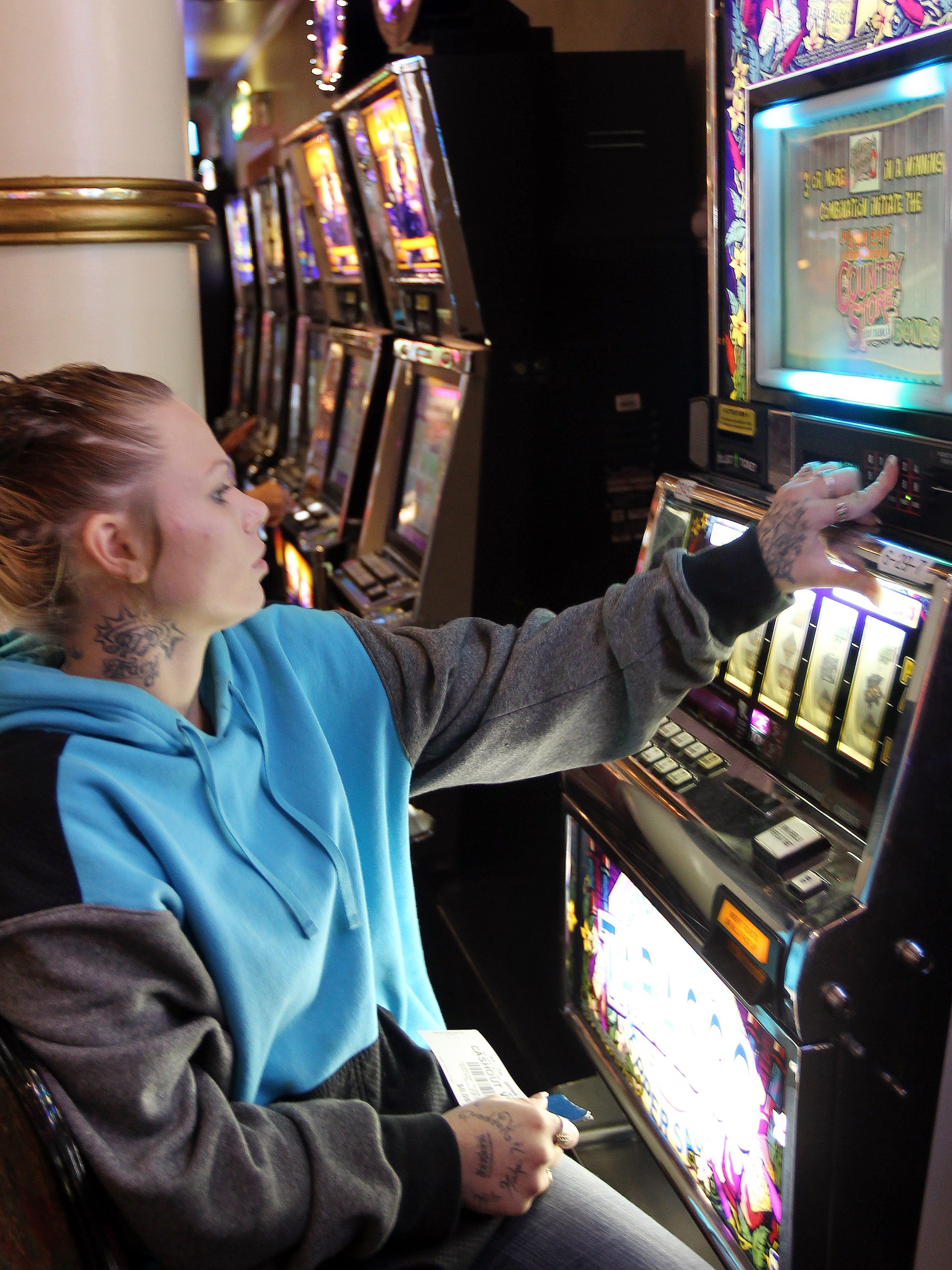 Kaylee Ledbetter, 23, of Indianapolis, plays the slot machines at Rising Star Casino, Rising Sun, IN. The Enquirer/Patrick Reddy