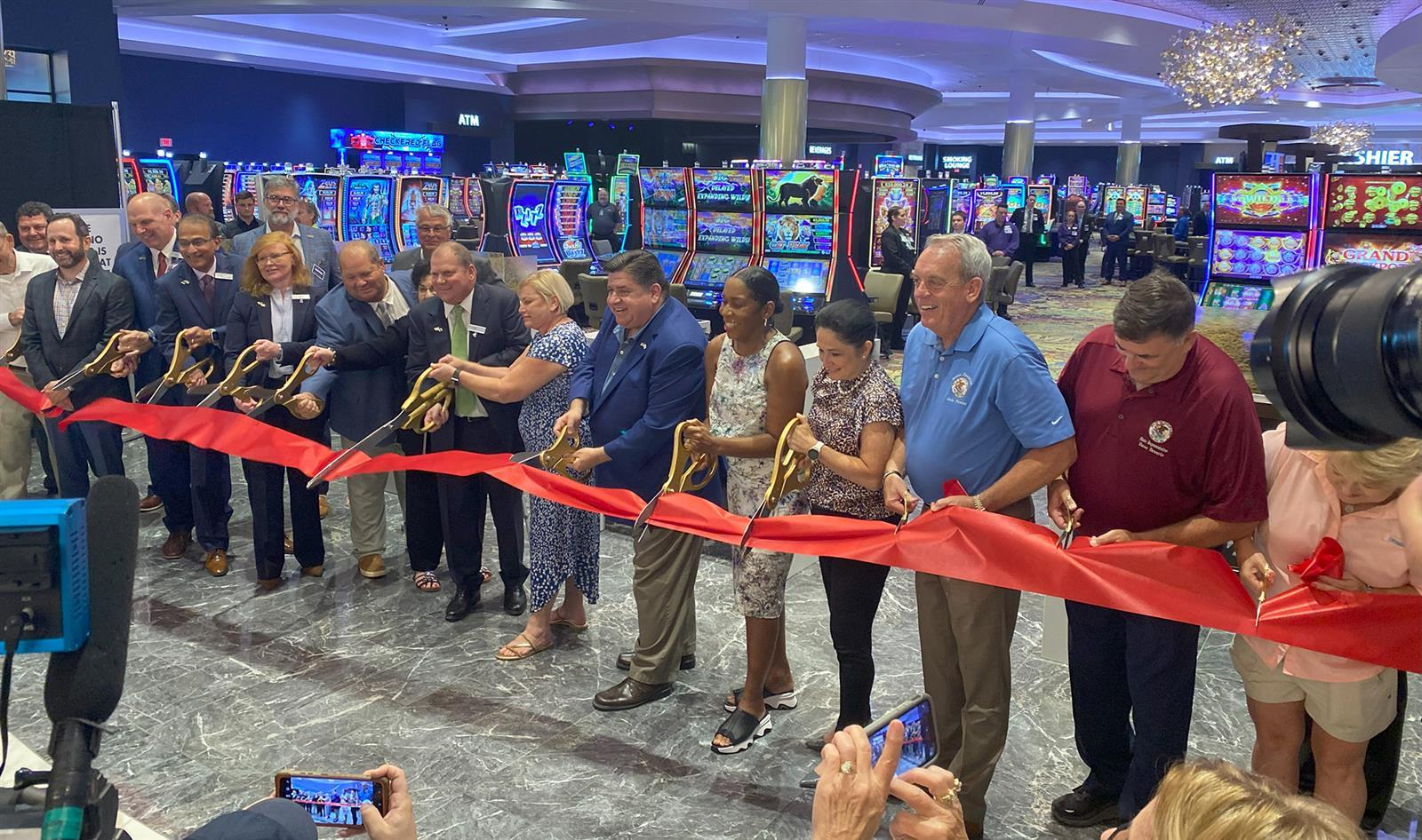 Gov. JB Pritzker (center) is joined by state and local leaders to cut the ribbon on Walker’s Bluff Casino and Resort on Friday, Aug. 25, 2023.