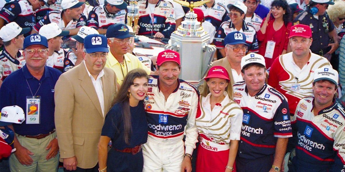Dale Earnhardt, center, poses with his wife, Teresa, left, and also members of his racing team, including crew chief Andy Petree, far right, after winning a race in 1994 at Indianapolis Motor Speedway.