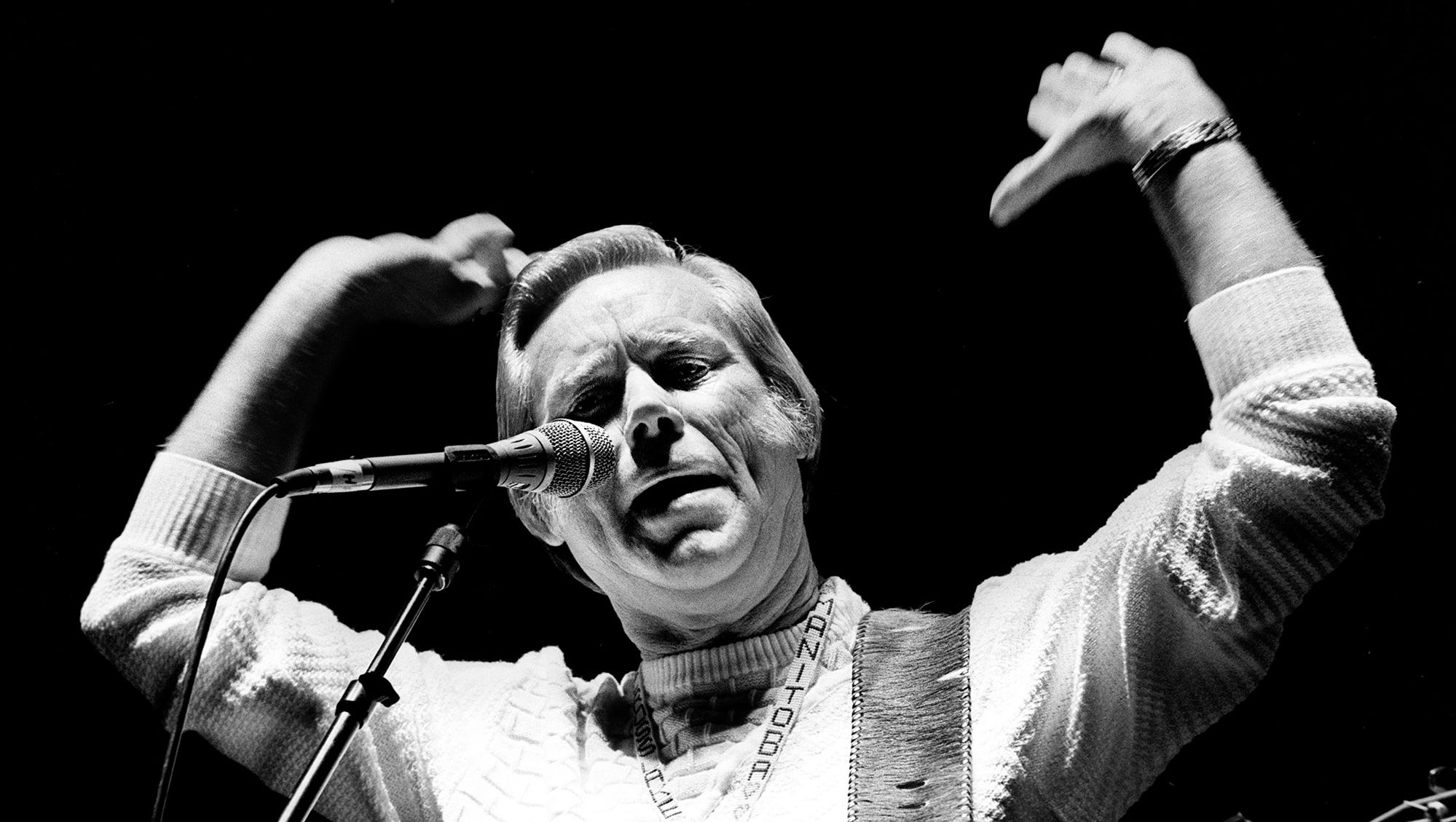 Country music superstar George Jones lights into "No Show Jones" to kick off his performance as part of the Starwood Amphitheatre concert, which also starred Merle Haggard. More than 12,000 fans turned out for a night of music by the hard-country legends July 24, 1987.