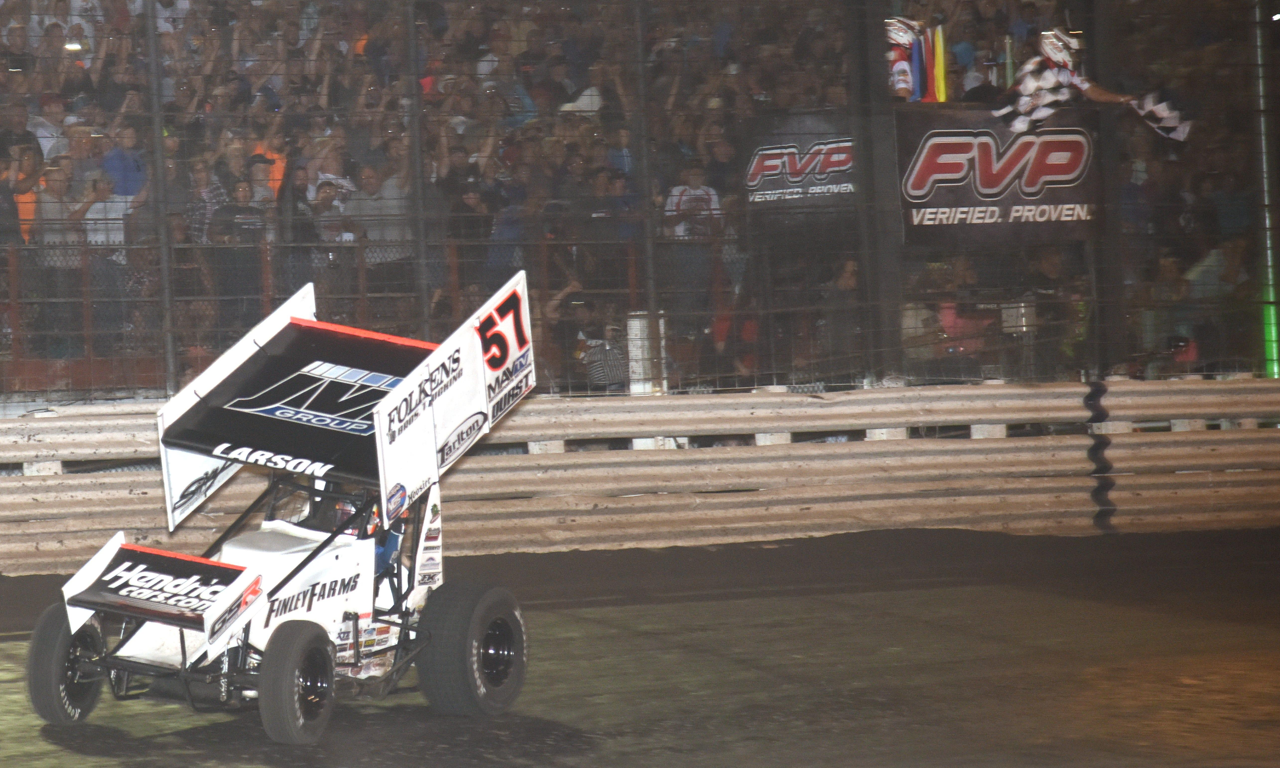 Kyle Larson takes the checkered flag to win the 60th annual Knoxville Nationals Saturday at Knoxville Raceway.