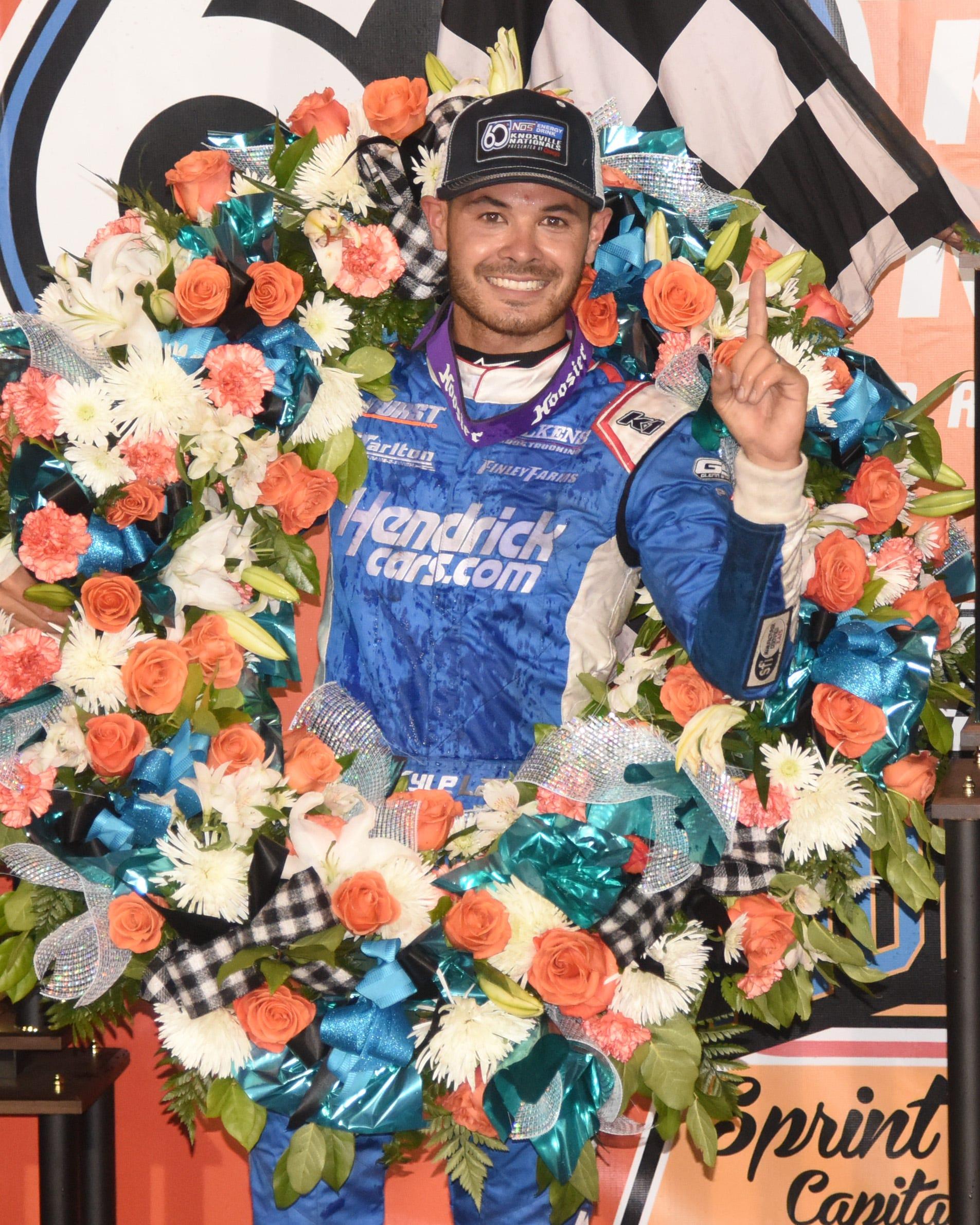 Kyle Larson wears the winner