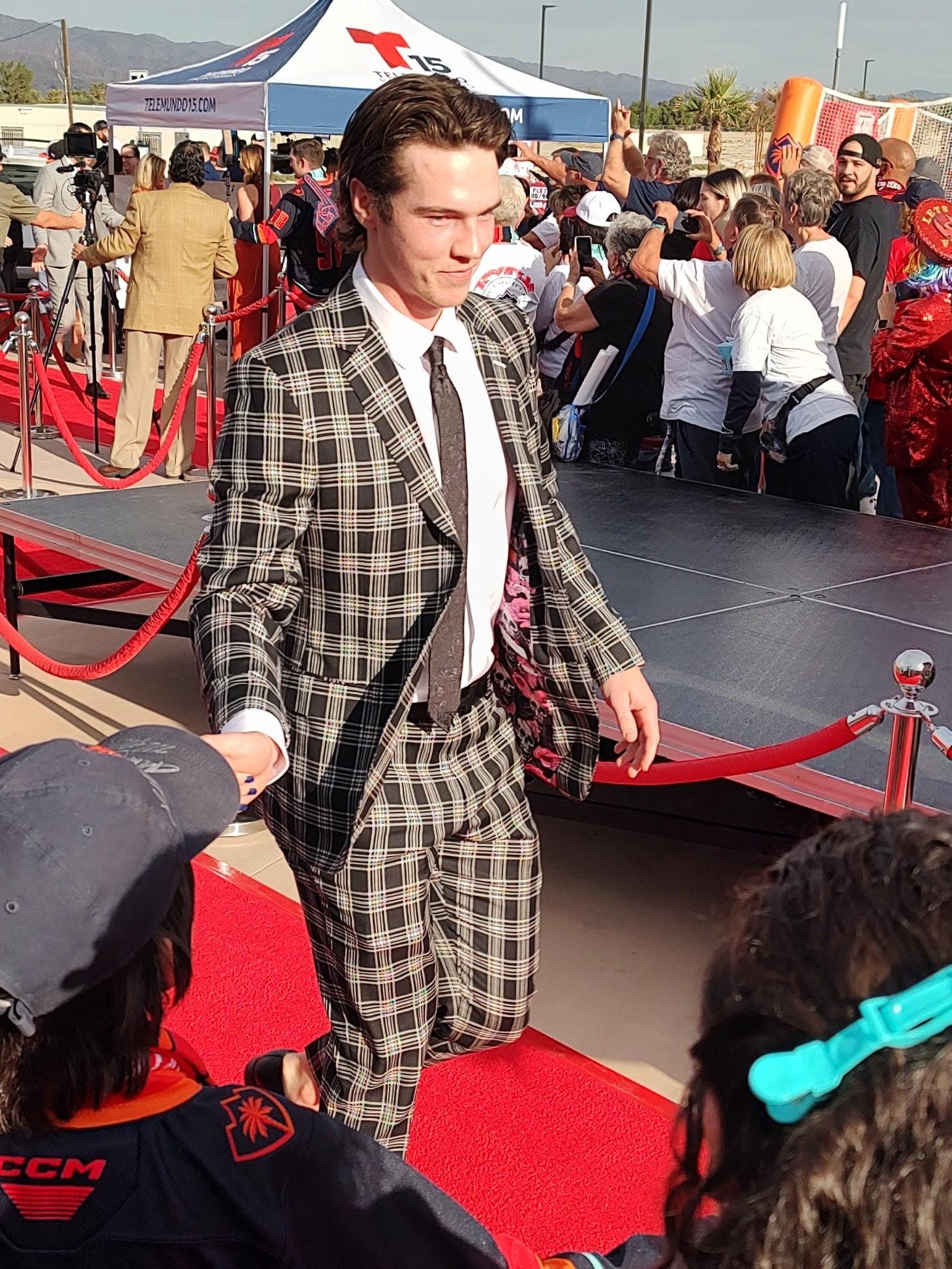 Coachella Valley Firebirds newcomer Cale Fleury walked the red carpet with a stylish big-checked suit at Acrisure Arena ahead of the Firebirds