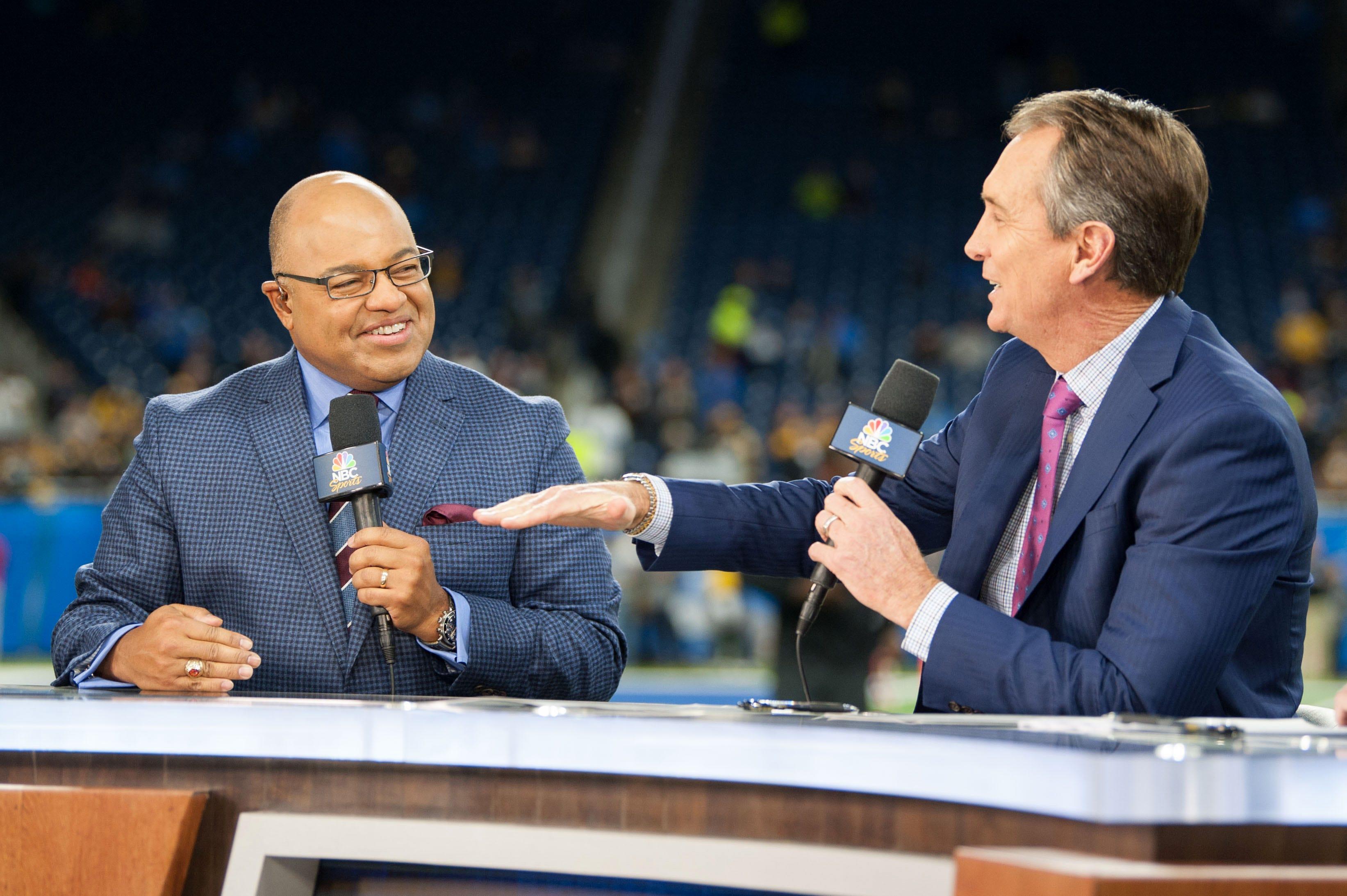 NBC Sports broadcasters Mike Tirico and Cris Collinsworth are the announcers for the Sunday Night Football game between the Green Bay Packers and Minnesota Vikings in NFL Week 17.