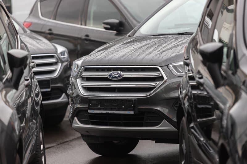 Ford cars in the parking lot with rain