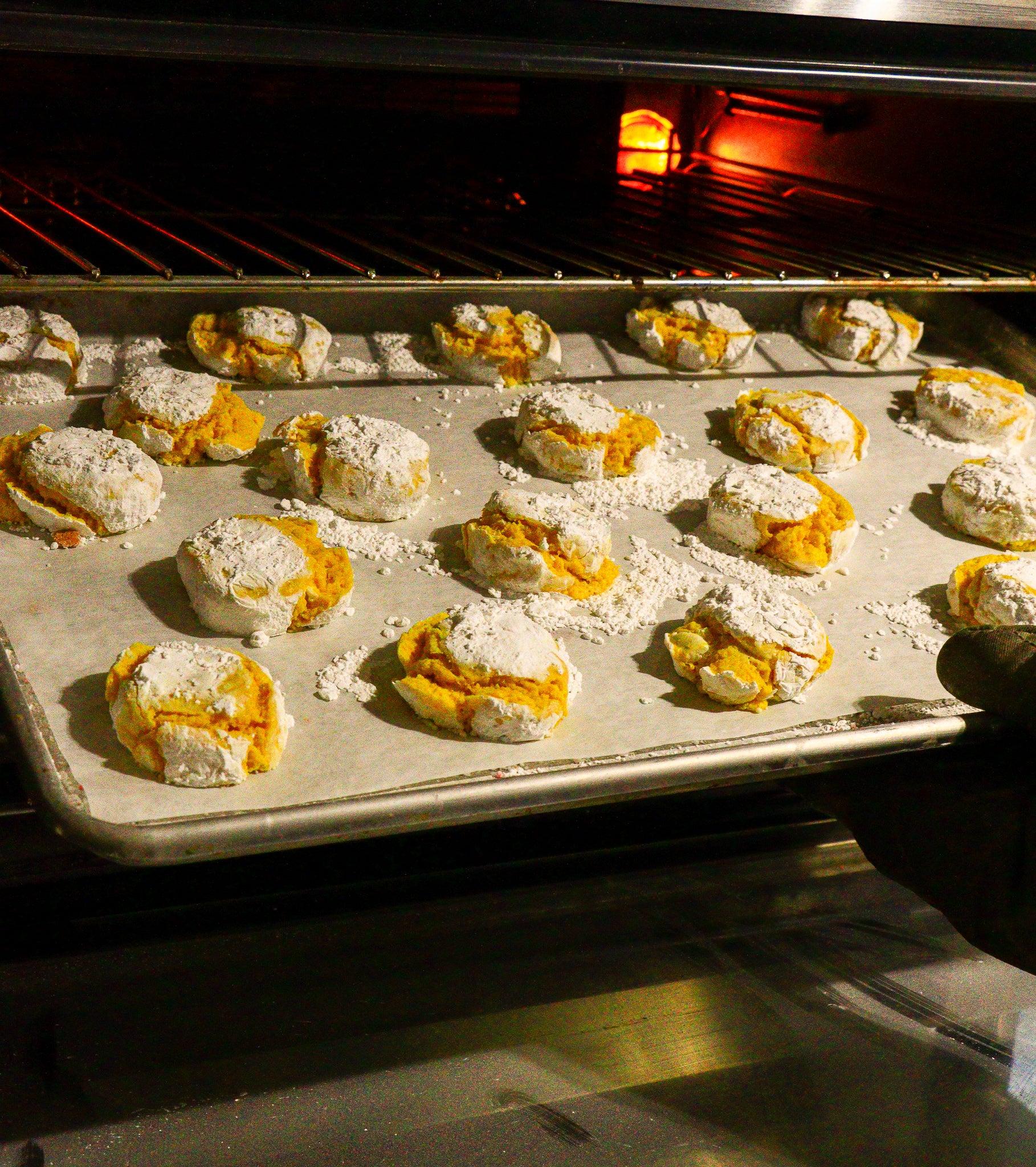 Cookies being placed into oven