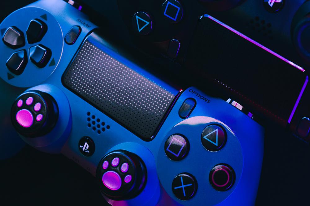 Playstation 4 Gamepad on black background with color lights