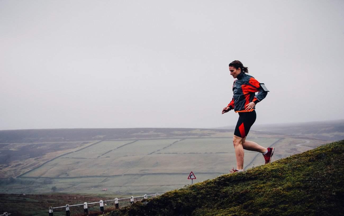 A runner running downhill.