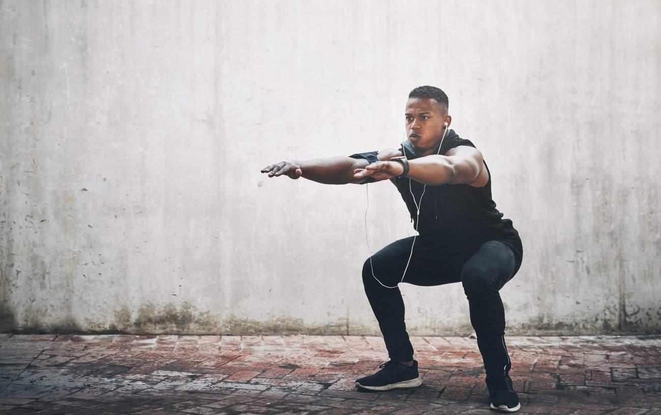 A man doing a squat.