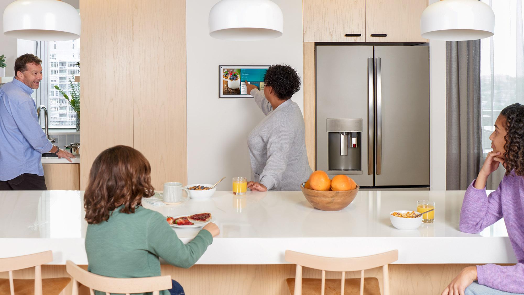 Amazon Echo Show 15 hanging horizontally on the wall in a kitchen.