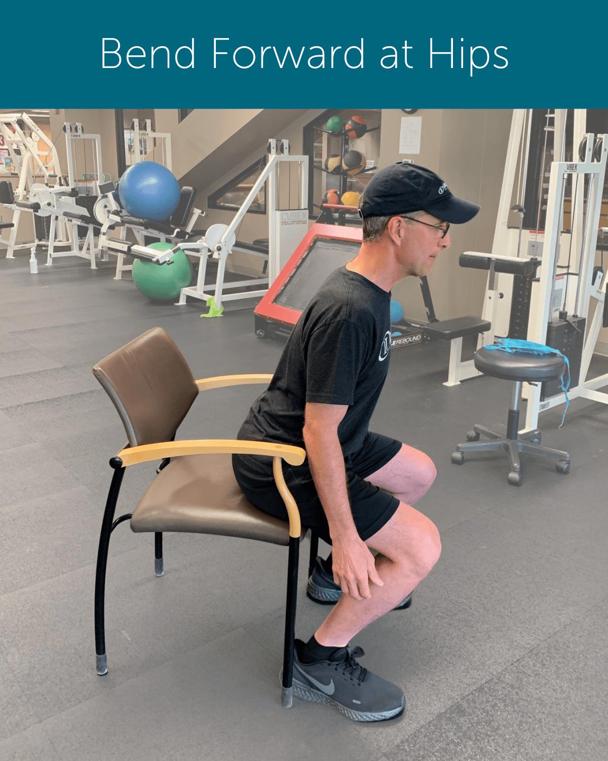 Orthopedic Institute Spine Therapist demonstrates proper sit to stand form by bending forward at the hips before rising to stand.