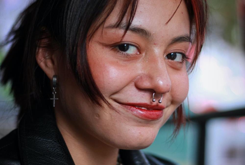 smiling woman face with septum piercing
