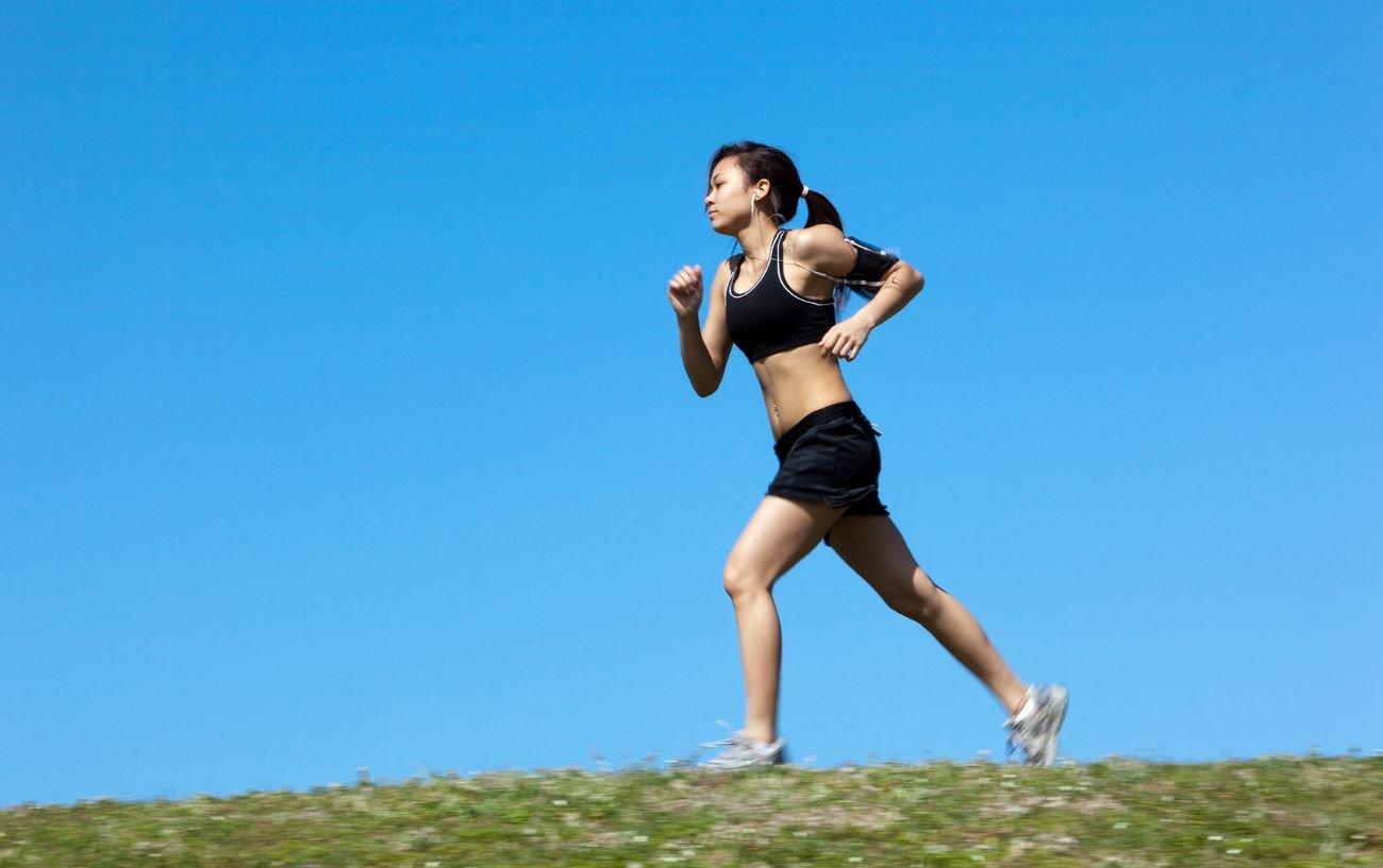 A person running on the grass.