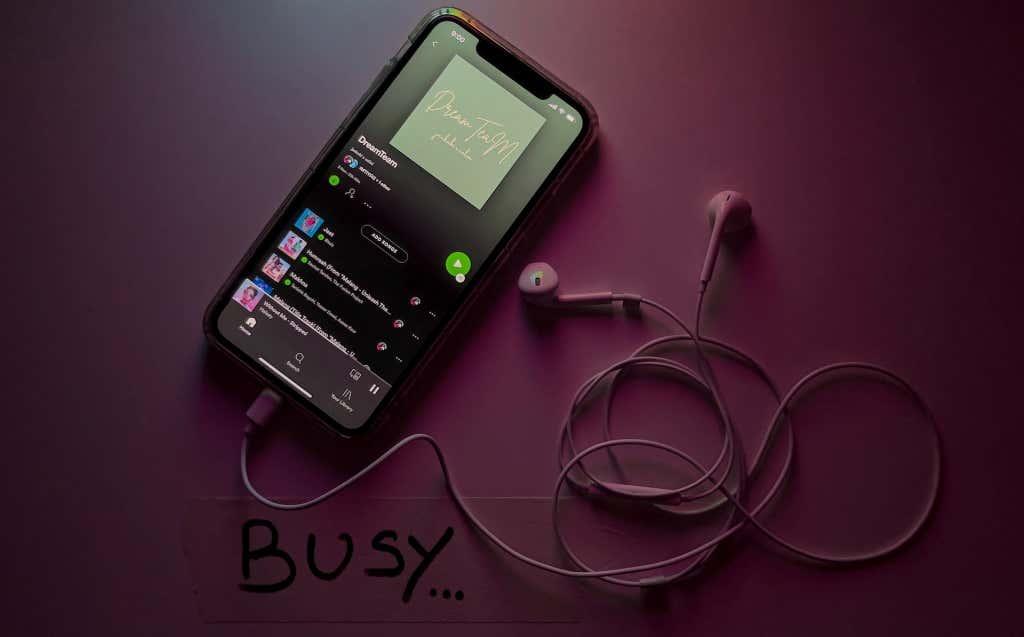 Spotify playlist on an iPhone connected to Apple Wired EarPods