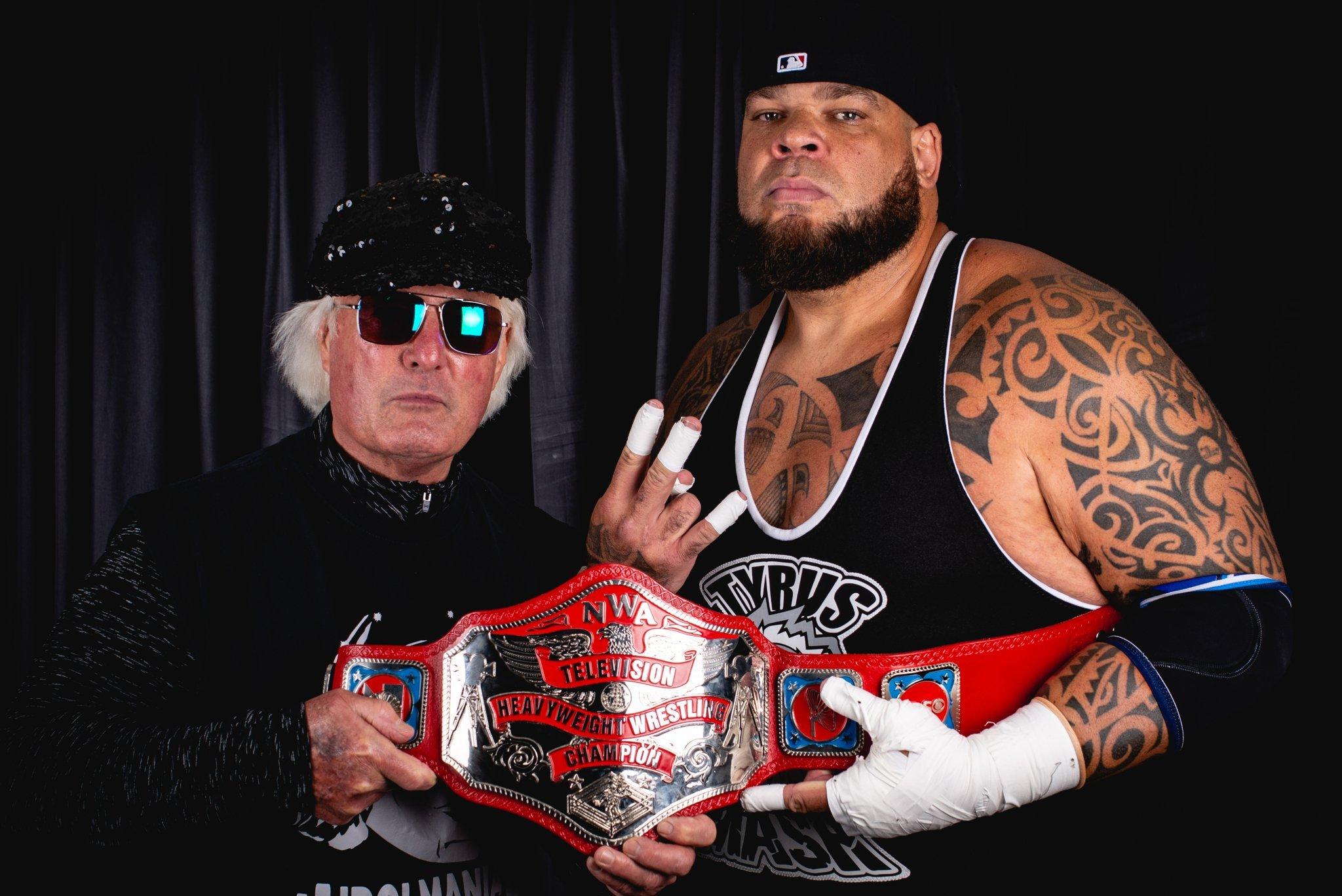 Austin Idol with the then NWA Television Heavyweight Wrestling Champion Tyrus in 2021.