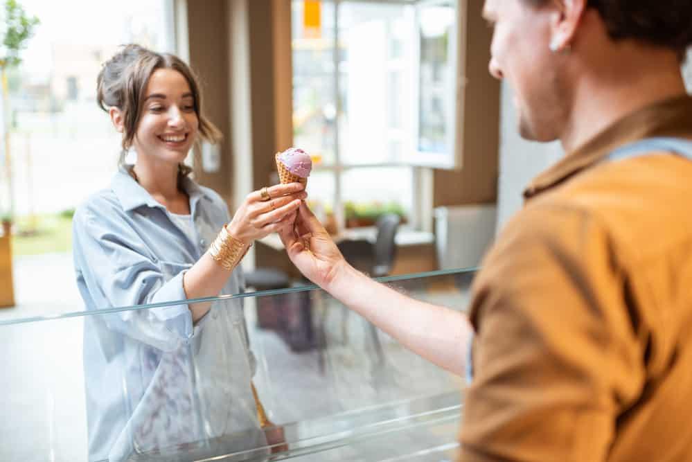 Man selling ice cream for a young woman