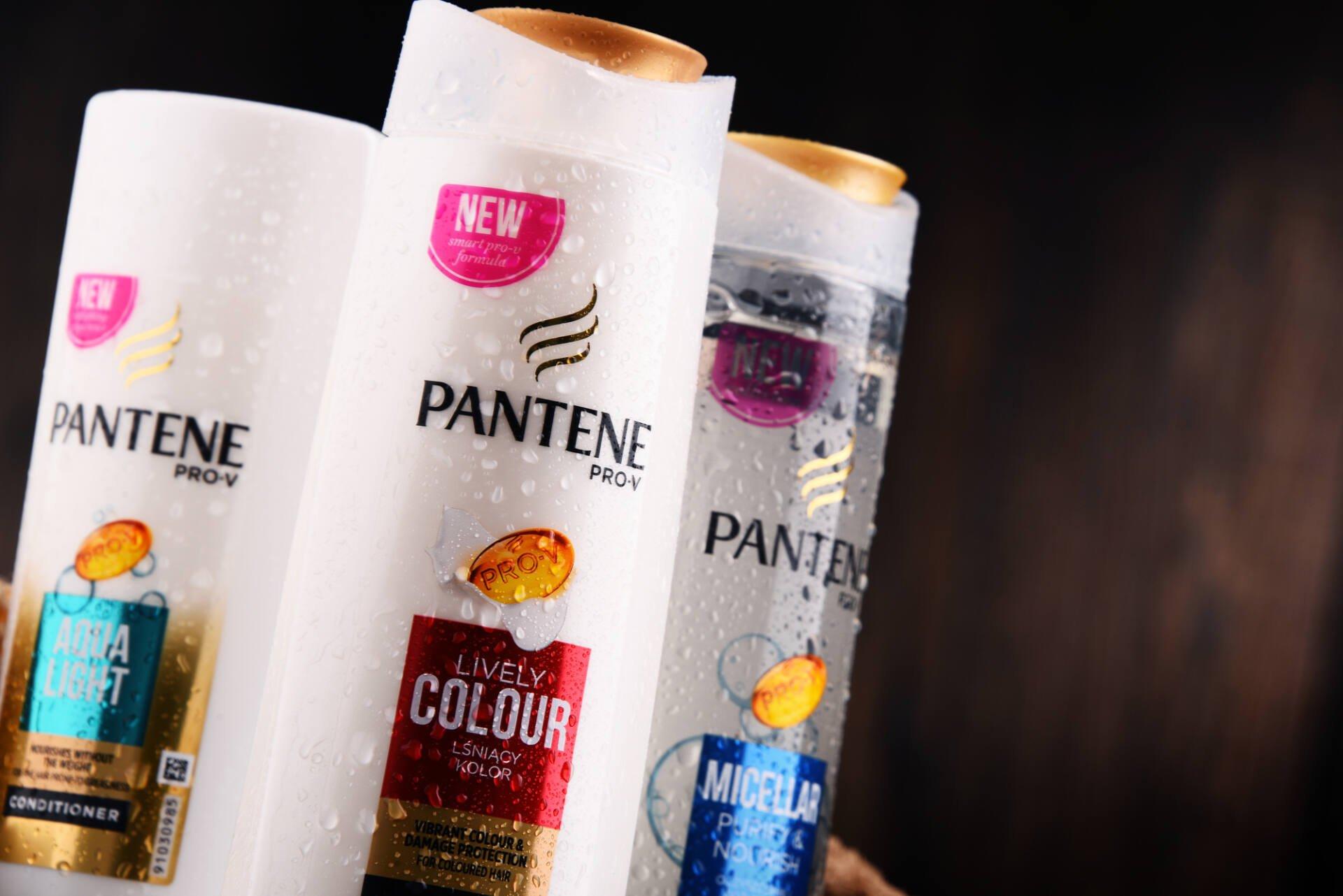 Bottles of Pantene shampoos with a dark brown background