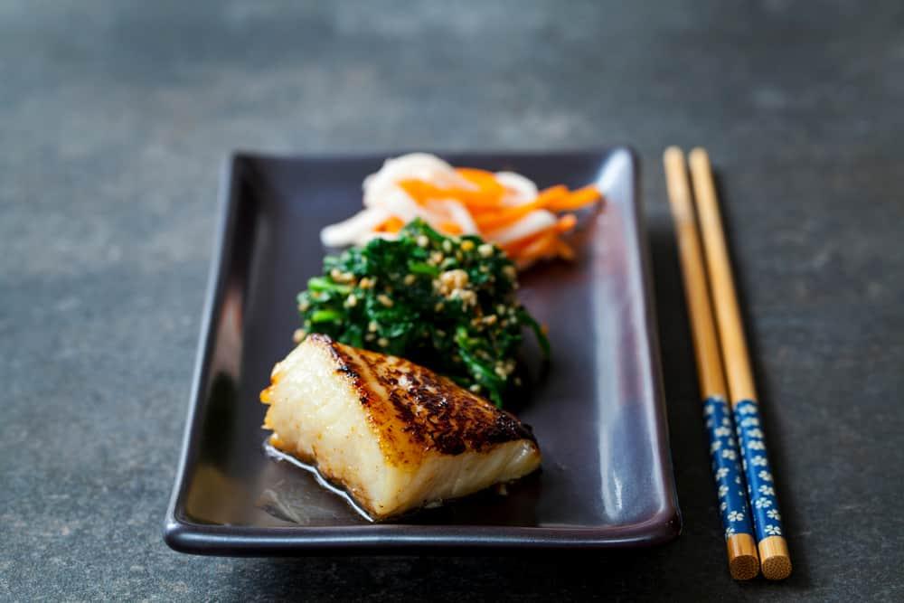 Miso marinated black cod with Japanese spinach salad gomaae