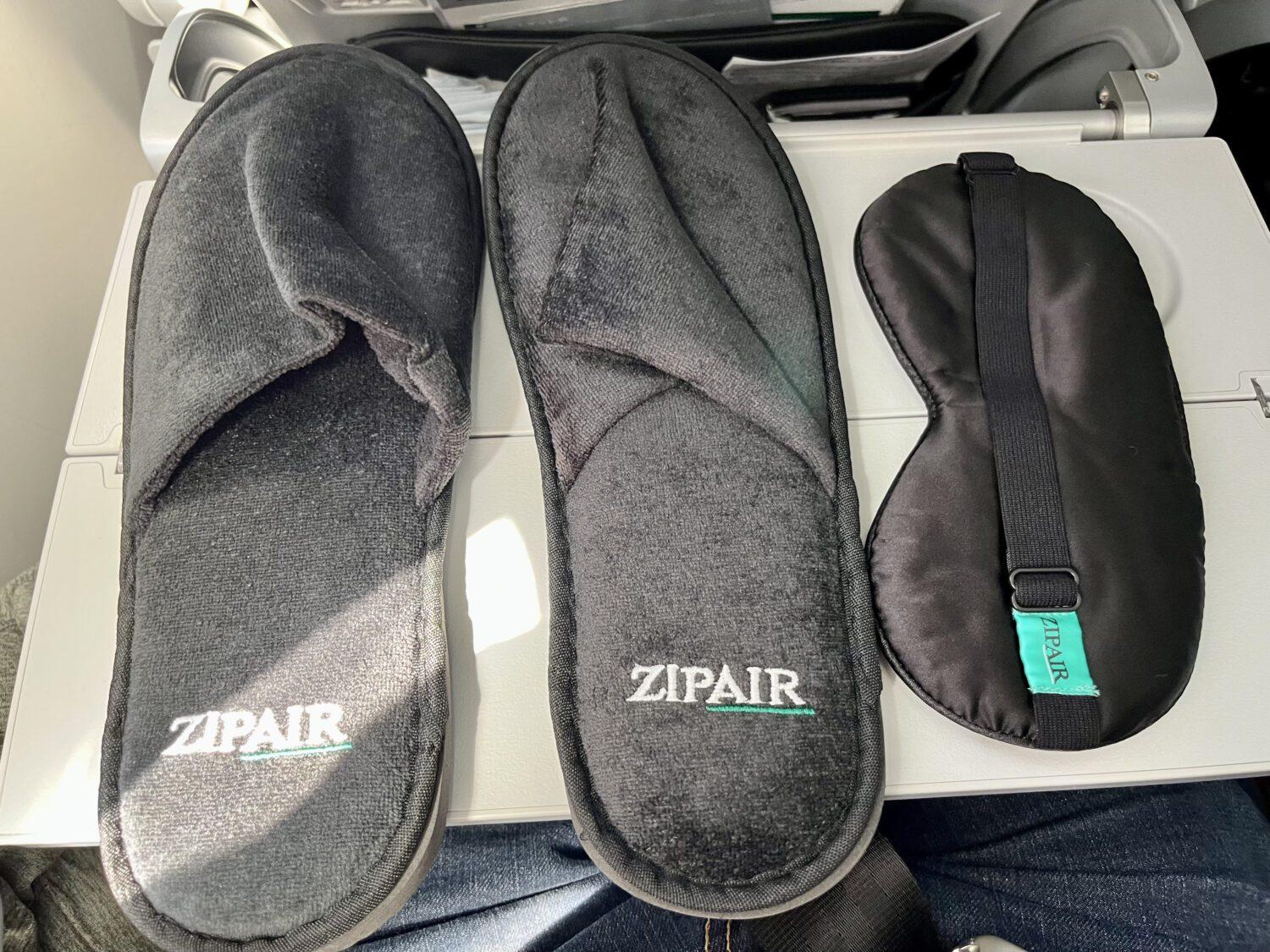 Zipair slippers and eye mask