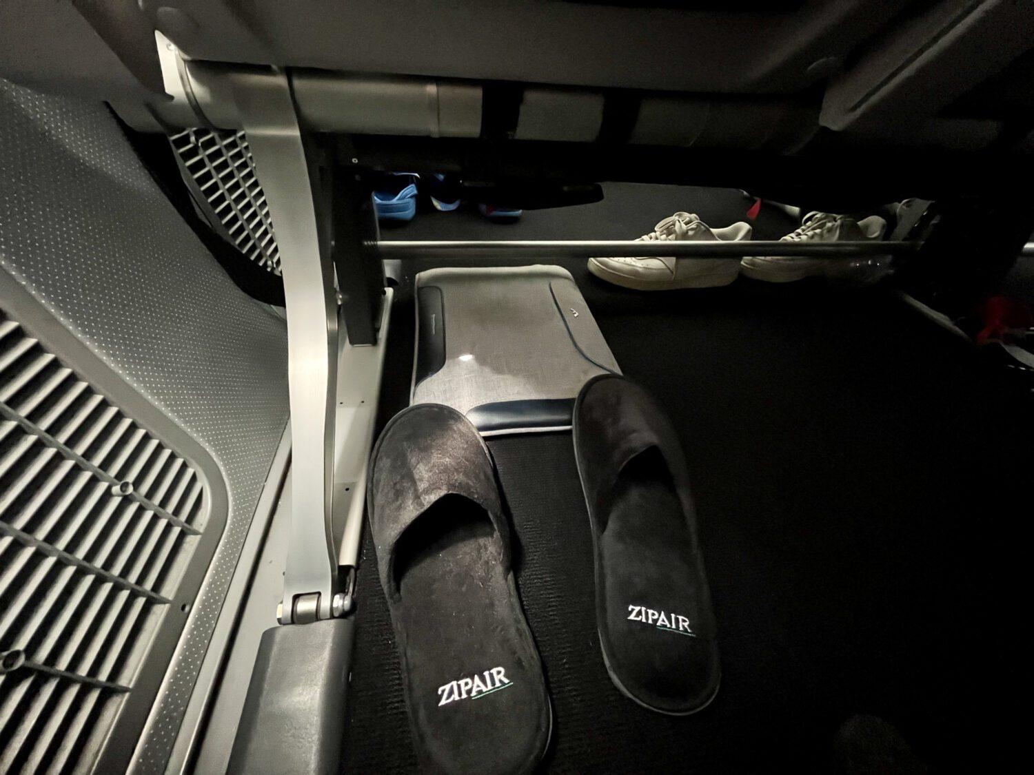 Zipair slippers under seat