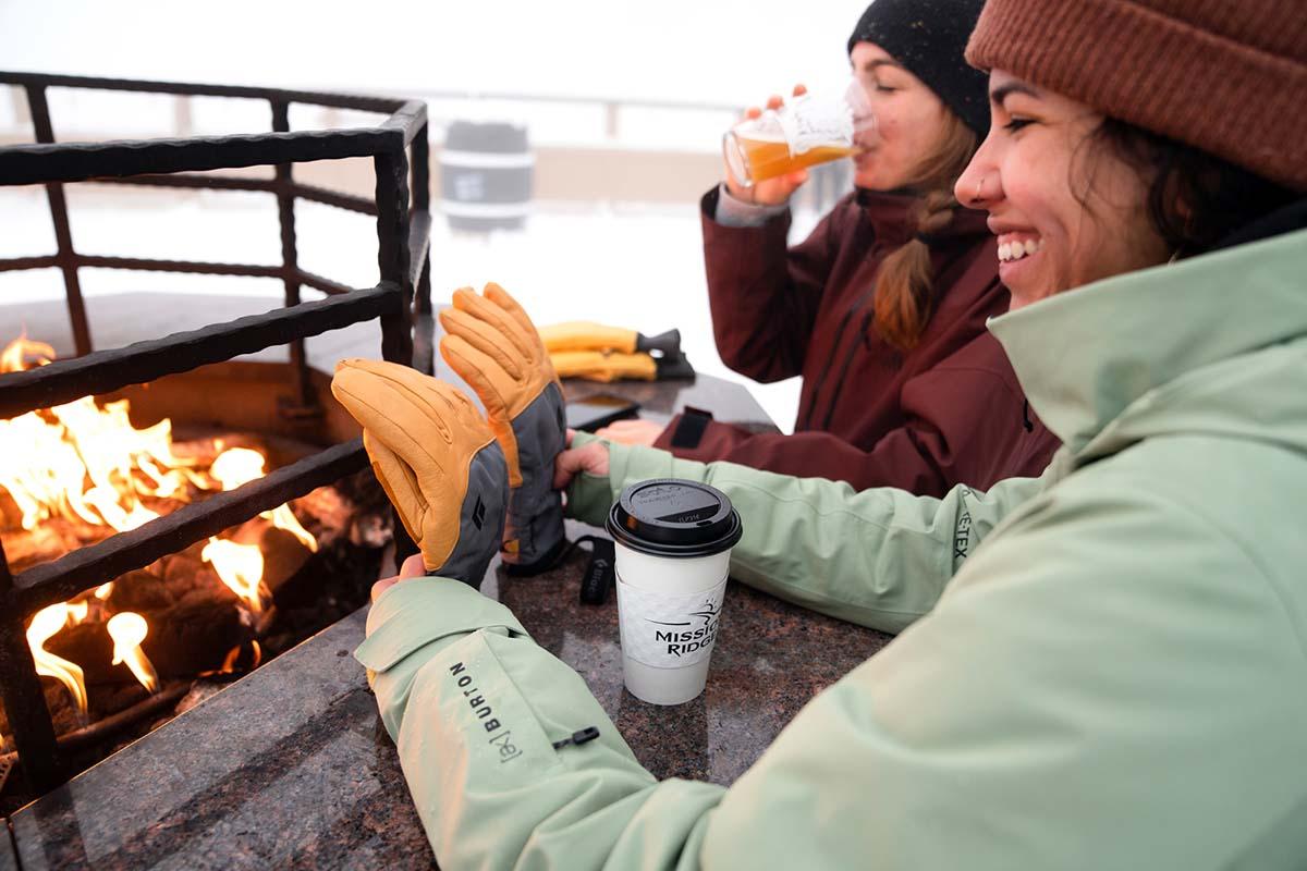 Drying out leather gloves by the fire (ski lodge)