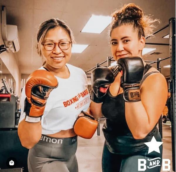 two boxers wearing B&B Method’s boxing gloves