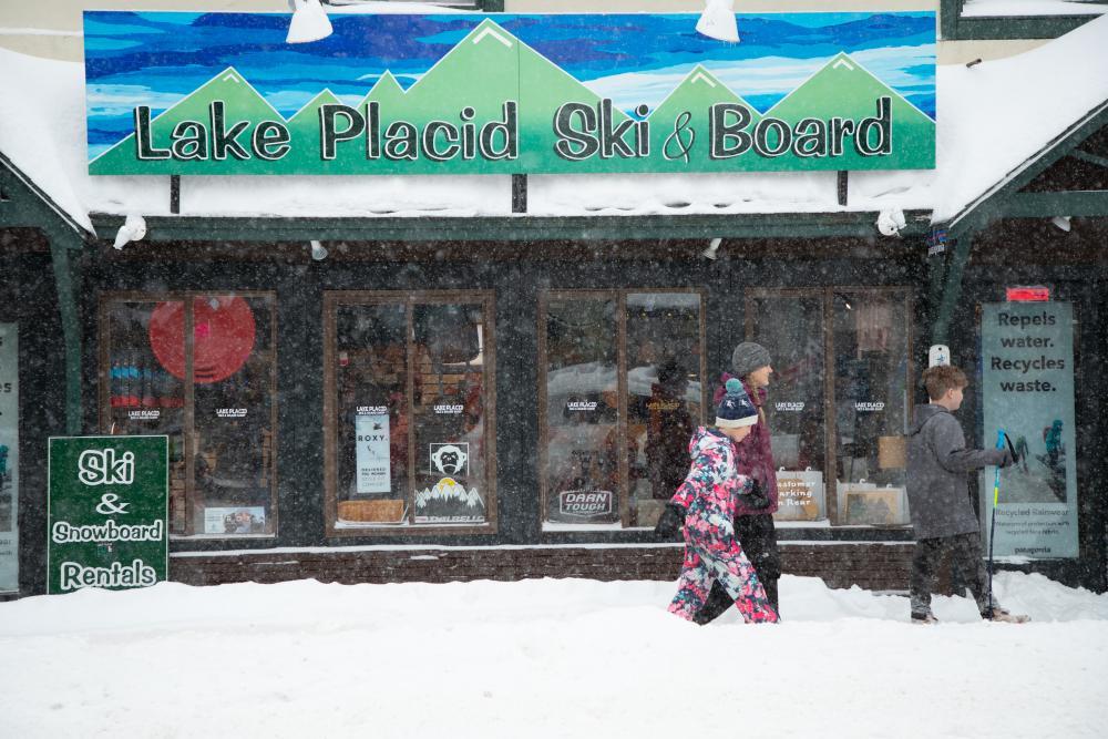 The front of High Peaks Cyclery covered in freshly fallen snow