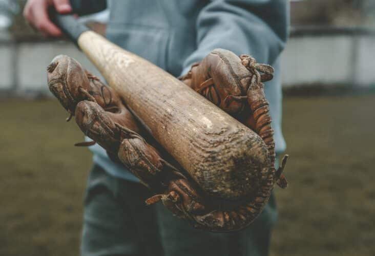 A person holding a bat in a glove