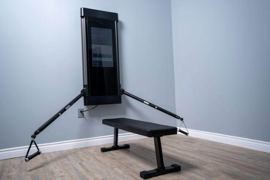 Tonal Smart Home Gym with bench in a home gym