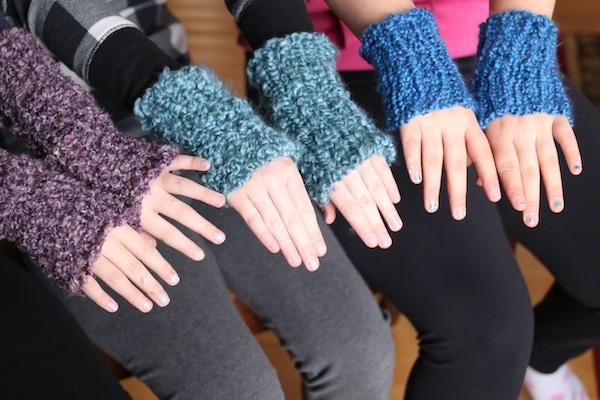 kids hands stacked wearing loom knit fingerless gloves