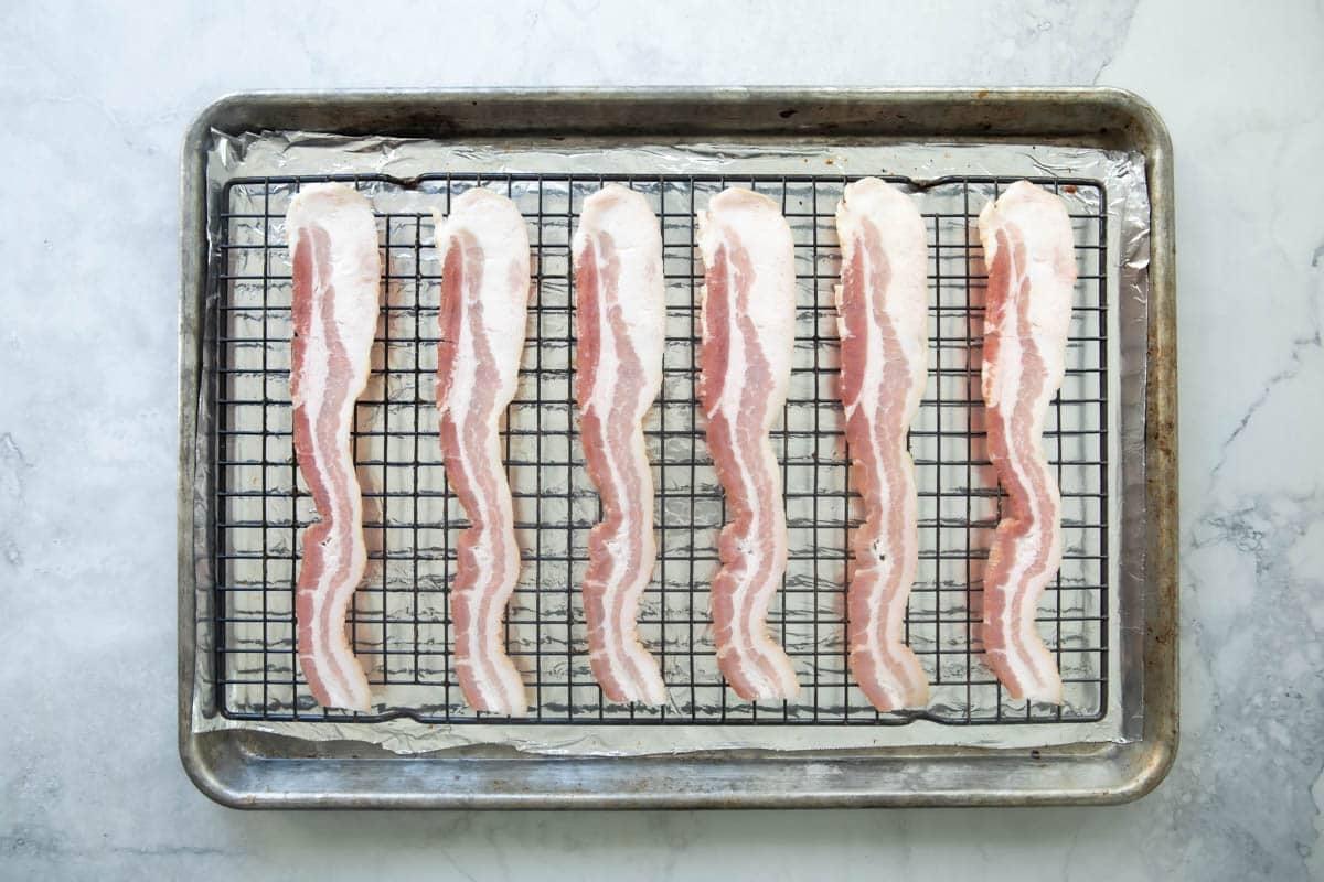 Cooking bacon on a rack in the oven.