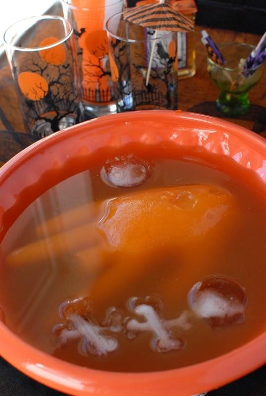 A bowl of punch , with ice Hand