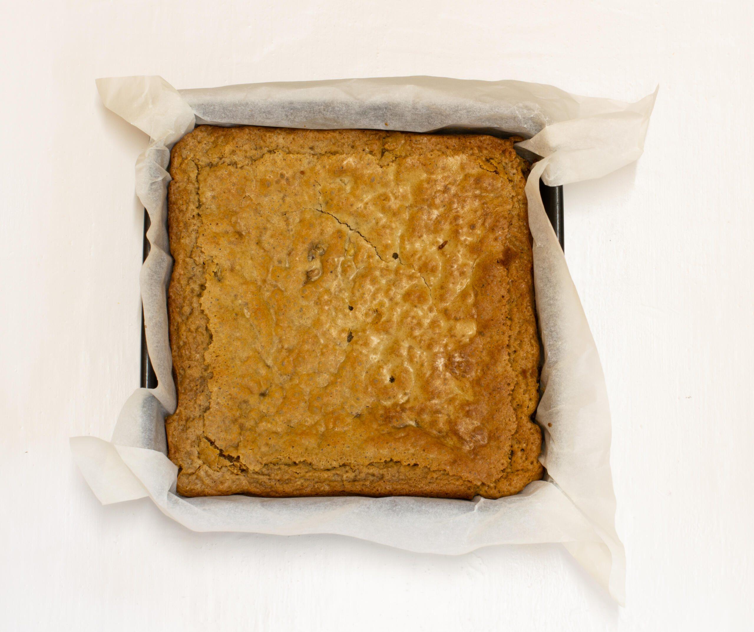 Cutting coffee blondies with large knife