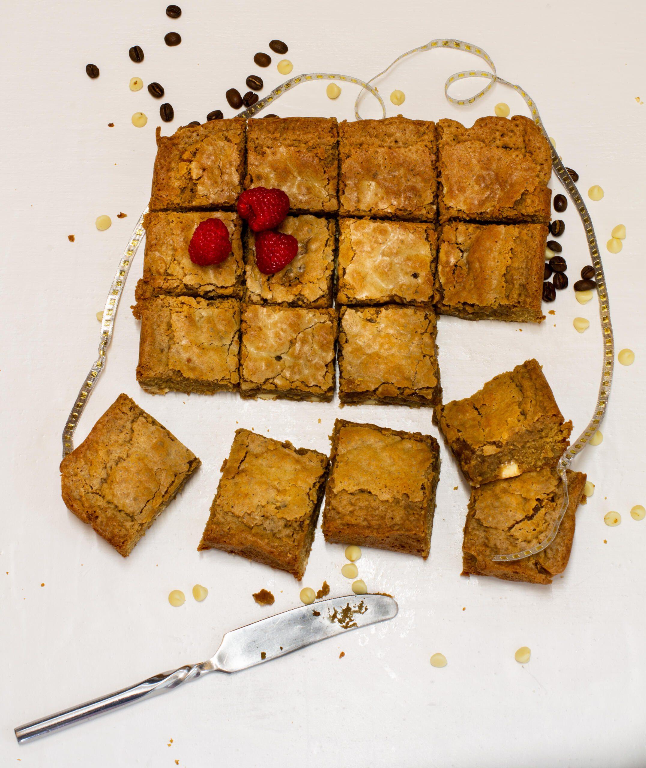 Smoothing icing over coffee cakes on cooling rack