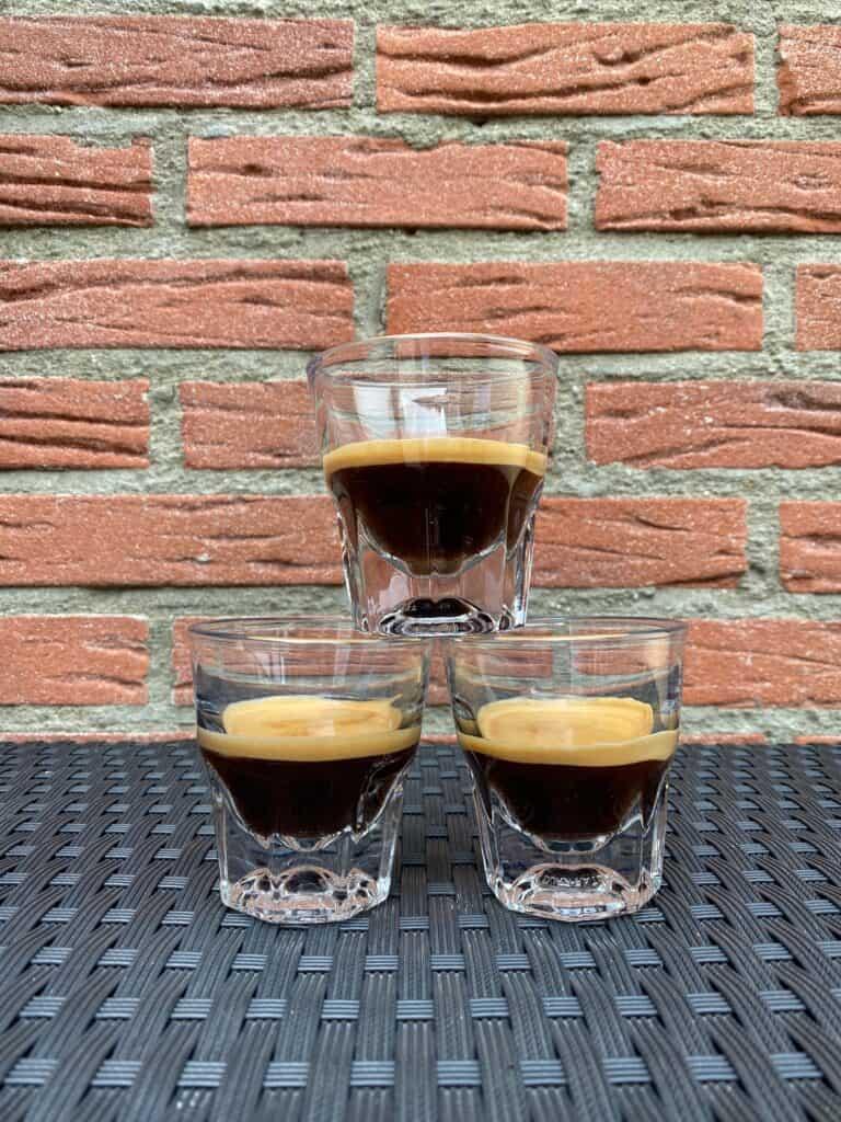 Three espresso shots stacked on top of each other.