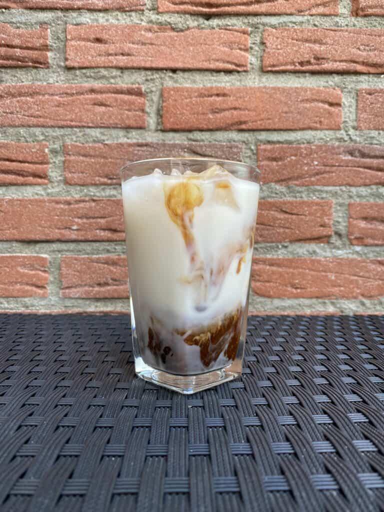 Iced almond milk latte, ready to drink.