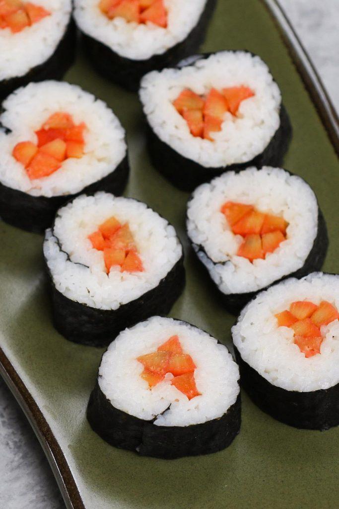 Gobo sushi rolls on a Japanese plate.
