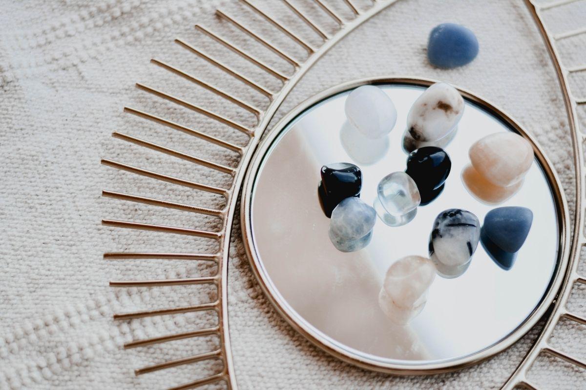 collection of gemstones on mirror