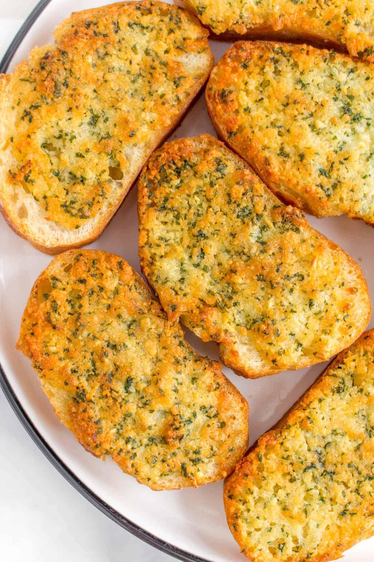 Close up of garlic bread on a plate.