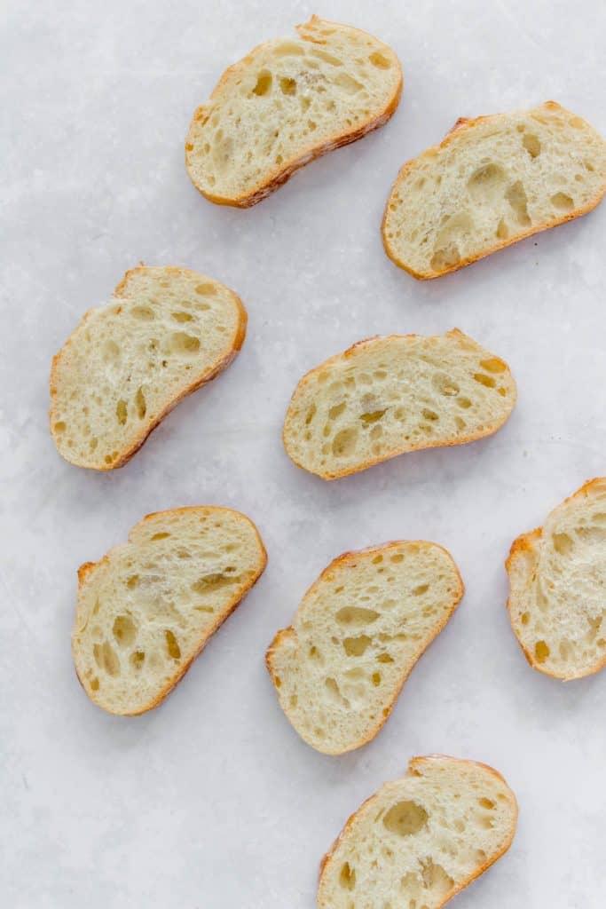 Baguette with garlic butter spread on.