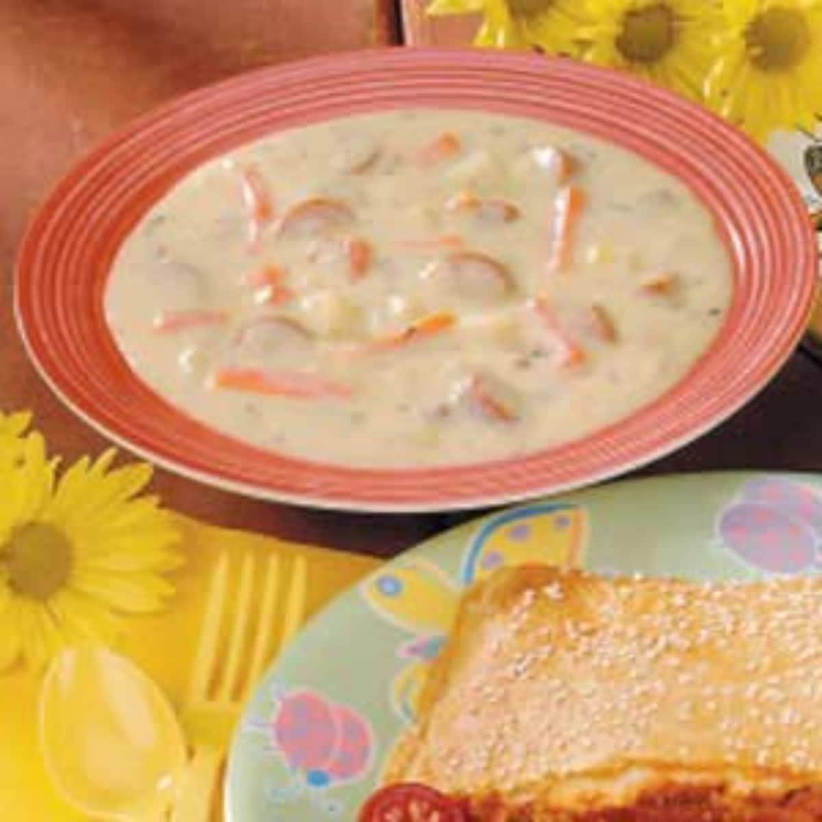 Creamy hot dog soup on a plate.