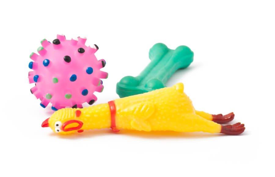 Three colorful dog toys