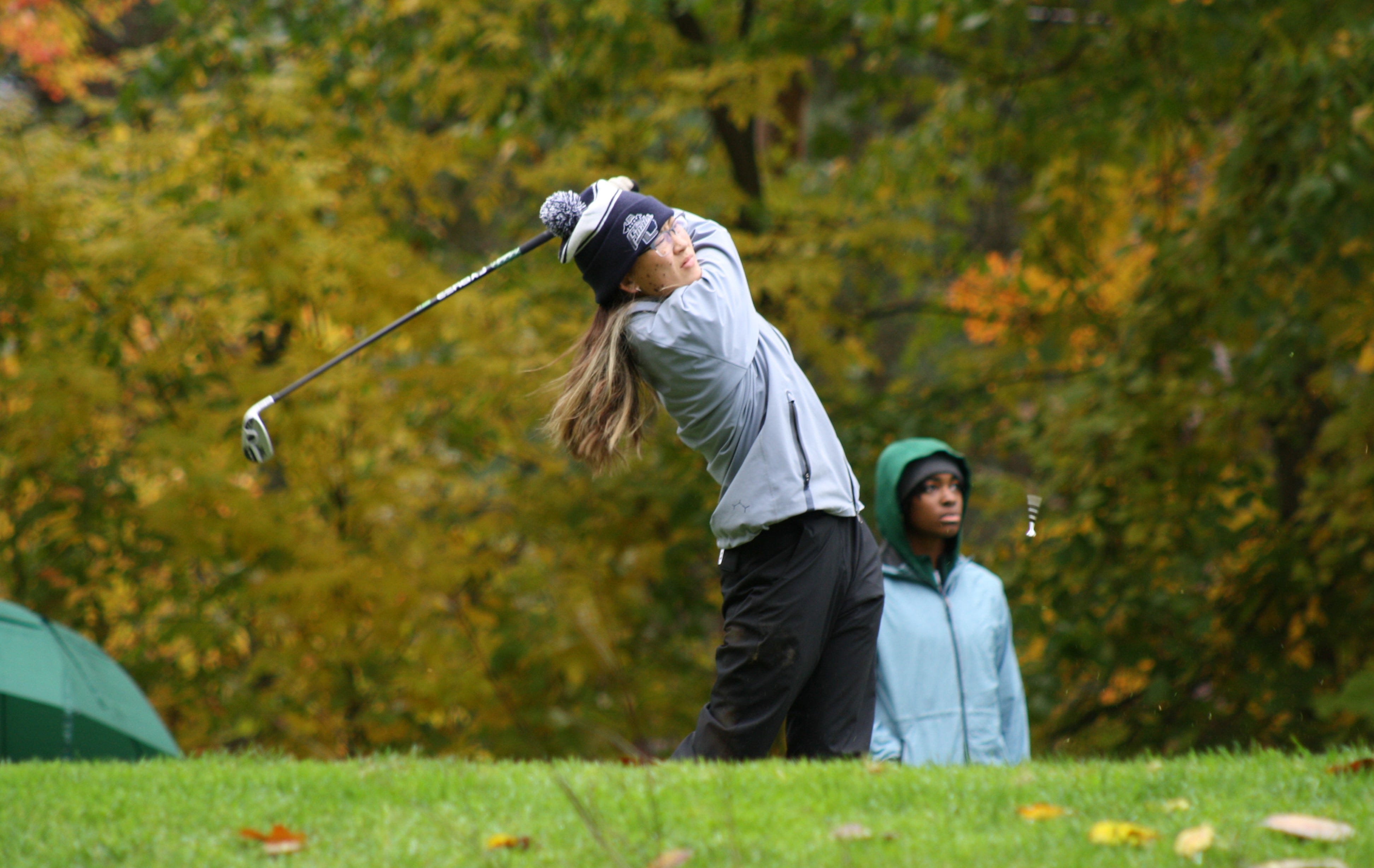 Megan Luke of Utica Eisenhower tees off during the Division 1 girls golf state finals at Michigan State in October.