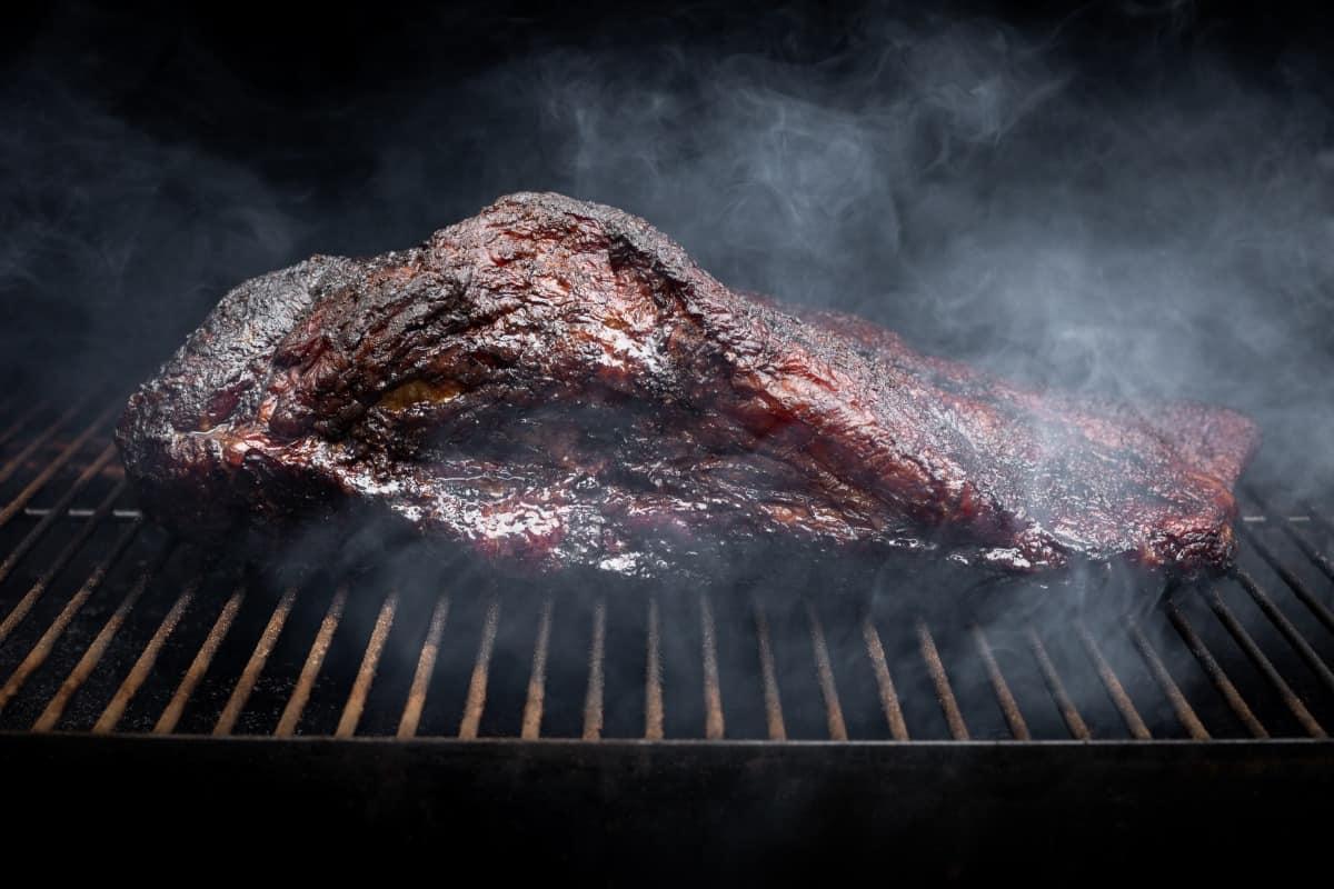 Brisket with a deep, dark bark in a smo.