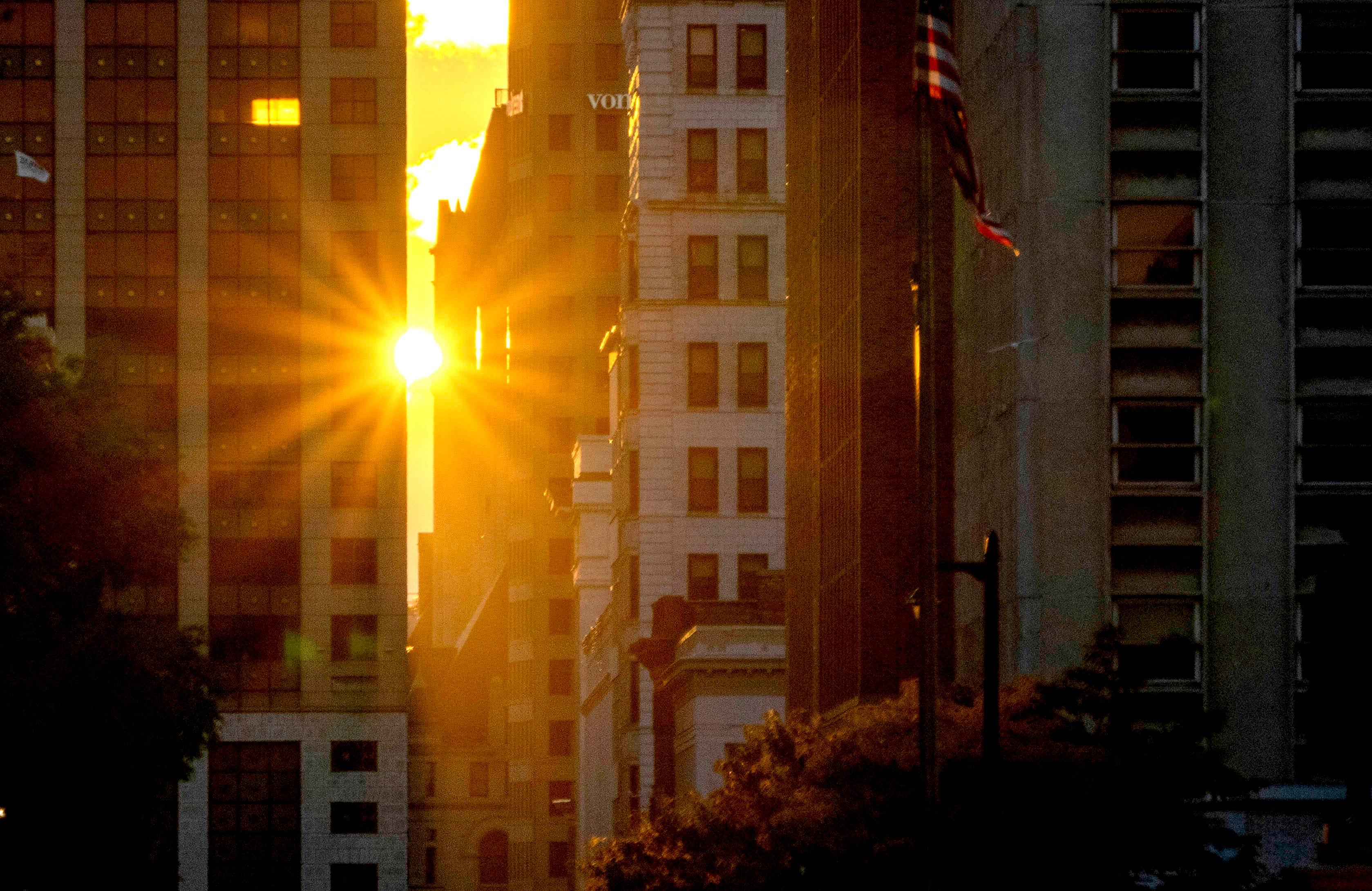 The sun rises over West Wisconsin Avenue Milwaukee on the first day of fall, Thursday, Sept. 22, 2022.