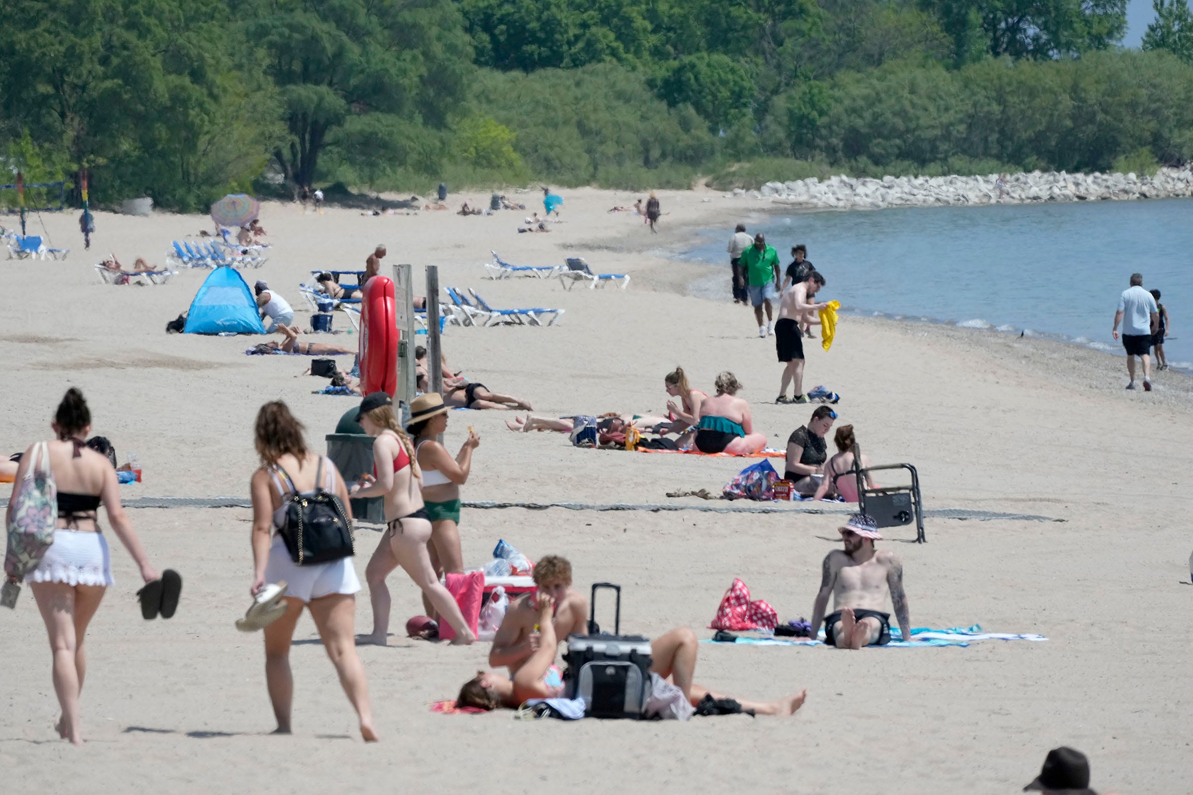 Beachgoers relax and sunbathe at Bradford Beach on North Lincoln Memorial Drive in Milwaukee on Thursday, June 1, 2023.