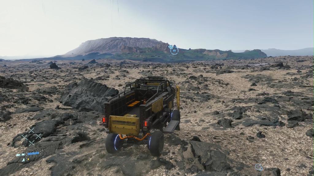 Sam drives over rocky terrain.