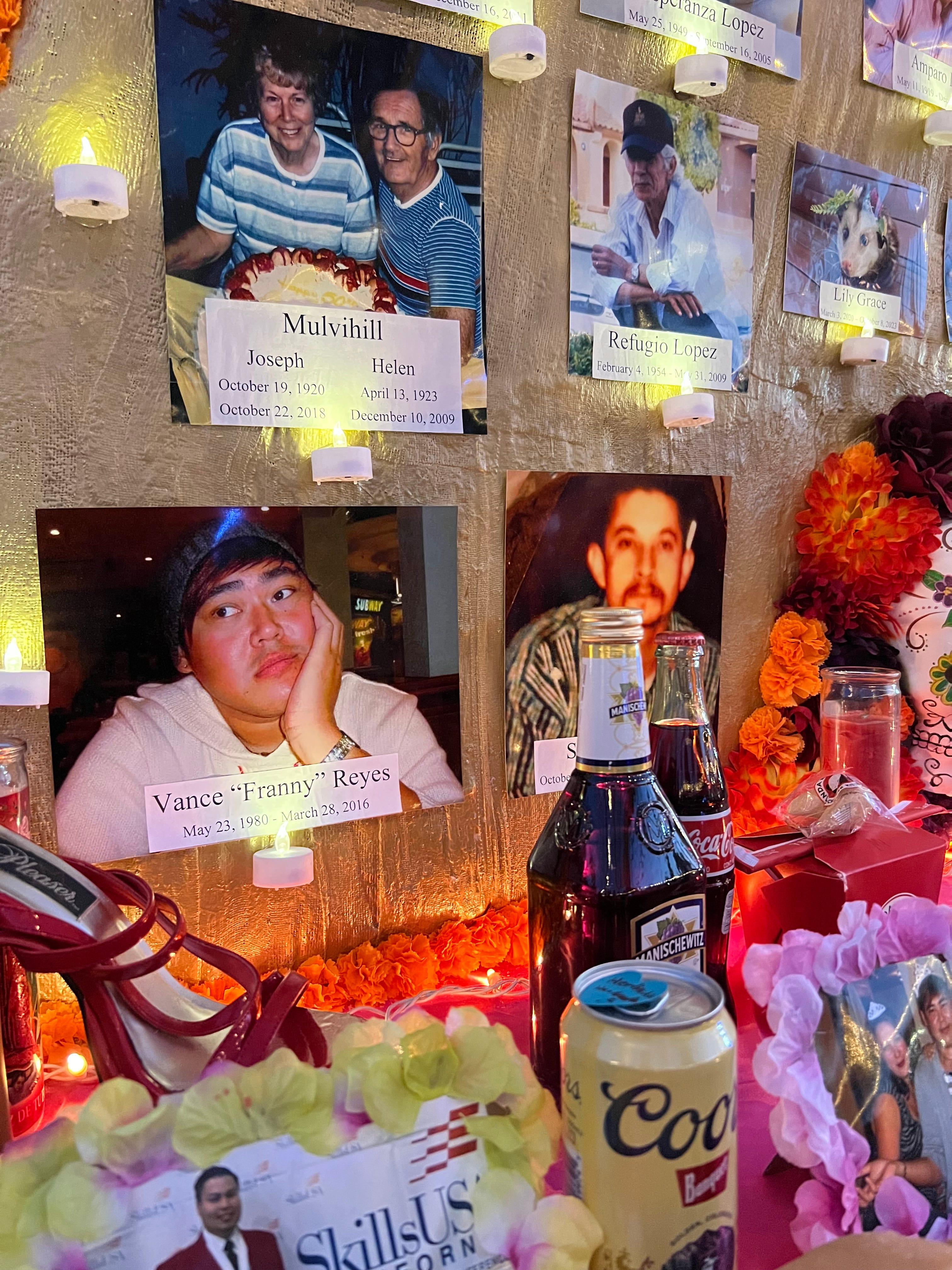 Photos of loved ones who have passed away, including an opossum named Lily Grace, are displayed alongside "ofrendas," or offerings," at the Día de Los Muertos celebration at the Hollywood Forever Cemetery in Los Angeles on Saturday, Oct. 28, 2023.