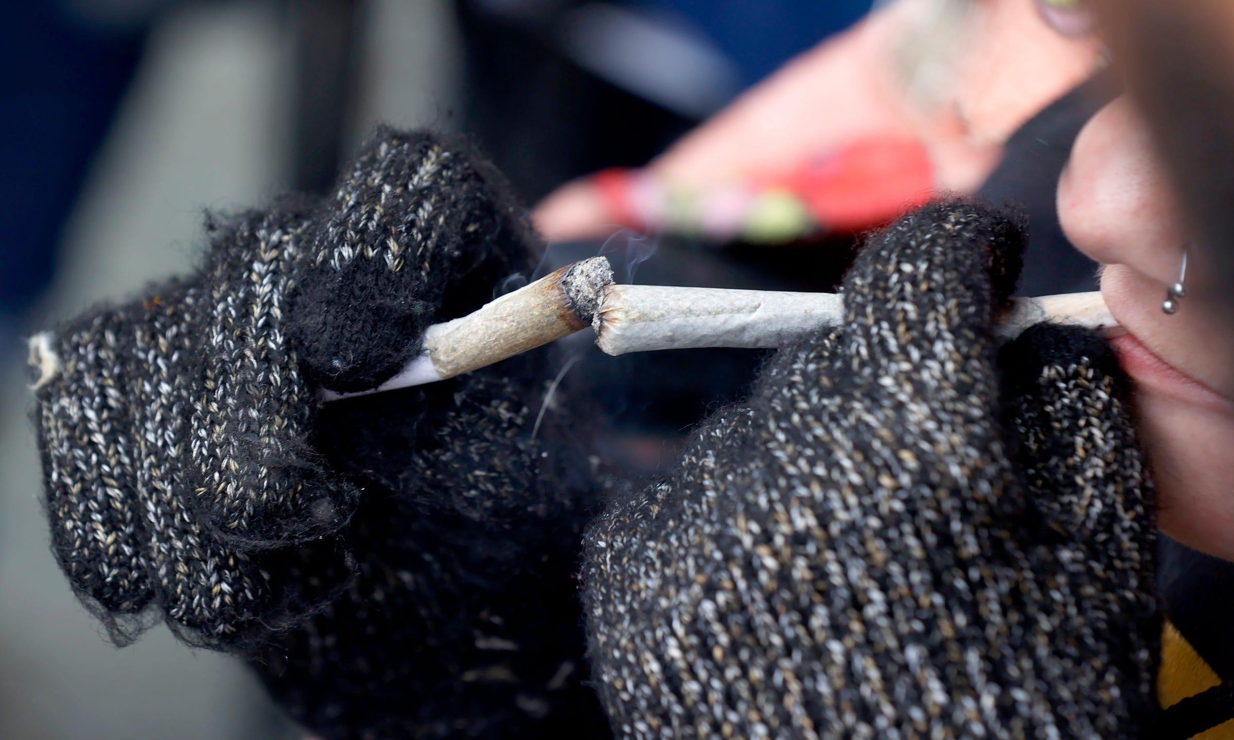 One of many joints being lit by people during Hash Bash 2023 at the Diag on the campus of the University of Michigan in Ann Arbor on Saturday, April 1, 2023.